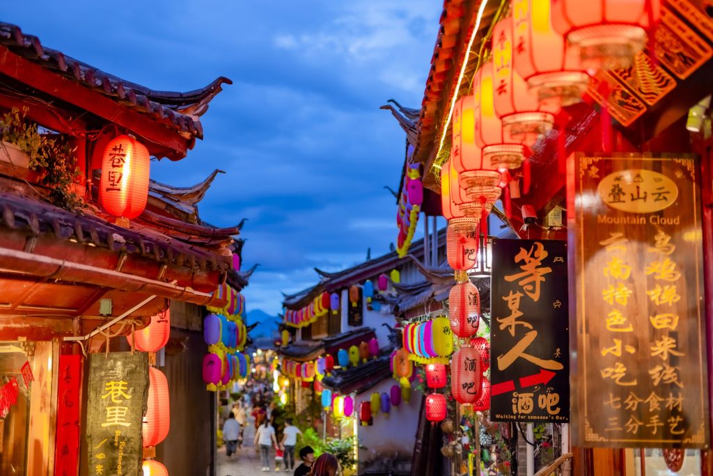 Malaysian tourists exploring Yunnan ancient town streets